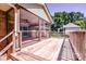 Spacious wooden deck with screened porch, offering a relaxing outdoor living space and a view of the backyard at 209 Woodstream Cir, Mooresville, NC 28117