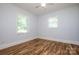 Well-lit bedroom with hardwood floors, two windows and neutral paint at 209 Woodstream Cir, Mooresville, NC 28117