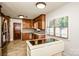 Kitchen featuring custom wood cabinetry, stainless steel appliances, and plenty of natural light at 209 Woodstream Cir, Mooresville, NC 28117