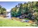 Picturesque lake view from the backyard showcasing pristine water, private docks, and lush vegetation at 209 Woodstream Cir, Mooresville, NC 28117