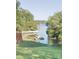 Lake Wylie waterfront featuring a well-manicured lawn with a dock for easy access to the water at 209 Woodstream Cir, Mooresville, NC 28117