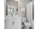 Bright bathroom features a shower/tub combo, a large mirror and a white vanity at 2111 Isom St, Charlotte, NC 28208