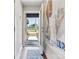 Home entryway features an abstract modern art piece and a full-view door with side lights at 2111 Isom St, Charlotte, NC 28208