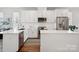 Well-appointed kitchen with stainless appliances, quartz counters and white cabinets at 2111 Isom St, Charlotte, NC 28208