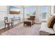 Comfortable living room features a large rug, hardwood floors, and a comfortable seating area at 2111 Isom St, Charlotte, NC 28208