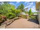 View of back deck with bench and arbor overlooking landscaped back yard at 2125 Chatham Ave, Charlotte, NC 28205