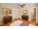 Bright bedroom featuring stylish furnishings, hardwood floors, and access to a private outdoor space at 2125 Chatham Ave, Charlotte, NC 28205