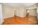 Sunlit room with hardwood flooring and neutral paint, offering a versatile space ready for personal design at 2125 Chatham Ave, Charlotte, NC 28205