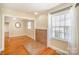 Versatile room with hardwood floors, a decorative hearth, and natural light for a cozy living area at 2125 Chatham Ave, Charlotte, NC 28205