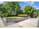 Well-maintained front yard with a retaining wall, lush lawn and landscaping of this charming home at 2125 Chatham Ave, Charlotte, NC 28205