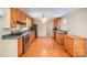 Full view of the kitchen featuring wood cabinets, modern appliances, and lots of storage at 2125 Chatham Ave, Charlotte, NC 28205