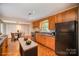 Spacious kitchen featuring wood cabinets, a breakfast nook, and modern appliances at 2125 Chatham Ave, Charlotte, NC 28205