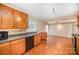 Kitchen featuring wood cabinets, modern appliances, tile floors, and lots of natural light at 2125 Chatham Ave, Charlotte, NC 28205