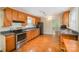 Well-lit kitchen featuring wood cabinets, modern appliances, and spacious counters at 2125 Chatham Ave, Charlotte, NC 28205