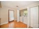 Functional laundry area equipped with washer and dryer hookups, enclosed by doors, and a tile floor at 2125 Chatham Ave, Charlotte, NC 28205