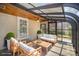 Inviting sunroom features a glass ceiling and modern furniture, creating a cozy relaxation space at 2125 Chatham Ave, Charlotte, NC 28205