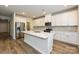 Modern kitchen featuring white cabinetry, stainless steel appliances, and a large island at 2127 Rolling Hills Ct, Stanley, NC 28164