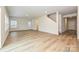 Open living room featuring wood-look floors, recessed lighting, and neutral paint at 2127 Rolling Hills Ct, Stanley, NC 28164