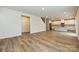 Open concept living space flowing into a kitchen with stainless steel appliances at 2127 Rolling Hills Ct, Stanley, NC 28164