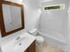 Bathroom featuring a vanity, a toilet, and a shower-tub combo with neutral colored tile at 2140 Majestic Poplar Dr, Waxhaw, NC 28173