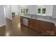 Bright and airy kitchen with a view of the pool and outdoor area at 2140 Majestic Poplar Dr, Waxhaw, NC 28173