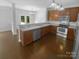 Well-equipped kitchen featuring ample counter space, stainless steel appliances, and hardwood floors at 2140 Majestic Poplar Dr, Waxhaw, NC 28173