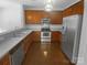 Well-lit kitchen featuring stainless steel appliances and ample cabinet space at 2140 Majestic Poplar Dr, Waxhaw, NC 28173