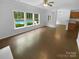 Living area offering views of the pool and seamlessly integrates with the kitchen at 2140 Majestic Poplar Dr, Waxhaw, NC 28173
