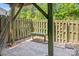 Backyard features a wooden fence and bench seating, providing a private and relaxing outdoor space at 218 Water Oak Dr, Pineville, NC 28134