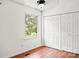 Bright bedroom features a window with a green outdoor view and a spacious closet at 218 Water Oak Dr, Pineville, NC 28134