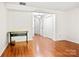 Bedroom with hardwood floors, a ceiling light and double closets at 218 Water Oak Dr, Pineville, NC 28134