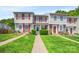 Charming townhome featuring a landscaped front yard and red shutters at 218 Water Oak Dr, Pineville, NC 28134