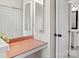 Hallway view with adjacent powder room showcases accessibility and mirrors to enhance light and space at 218 Water Oak Dr, Pineville, NC 28134