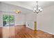 Bright living room with hardwood floors, ceiling fan and sliding glass door to the deck at 218 Water Oak Dr, Pineville, NC 28134