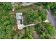 Expansive aerial view of the property featuring mature trees and a long driveway at 2202 Bearskin Ln, Monroe, NC 28110