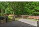 Expansive backyard with a wooden fence providing privacy and a deck, perfect for outdoor activities and relaxation at 2202 Bearskin Ln, Monroe, NC 28110