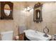 Cozy bathroom with decorative mirror, lighting, and a stylish sink and vanity, providing a charming space at 2202 Bearskin Ln, Monroe, NC 28110