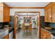 Dining area adjacent to the kitchen is enhanced by natural light, chandelier, and wood trim for an inviting experience at 2202 Bearskin Ln, Monroe, NC 28110