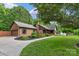 Brick home with attached garage, manicured lawn, and paved walkway leading to the welcoming front porch at 2202 Bearskin Ln, Monroe, NC 28110