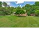 Beautiful brick home with lush, well-maintained front yard and mature landscaping at 2202 Bearskin Ln, Monroe, NC 28110