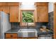 Well-equipped kitchen featuring modern stainless steel appliances, stylish cabinetry, and a view of the outdoors at 2202 Bearskin Ln, Monroe, NC 28110