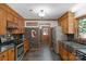 Well-appointed kitchen with modern appliances, ample cabinet space, and access to an adjacent dining area at 2202 Bearskin Ln, Monroe, NC 28110