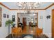Inviting living room with hardwood floors, elegant chandelier, and views of the adjoining spaces at 2202 Bearskin Ln, Monroe, NC 28110
