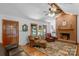 Inviting living room features a brick fireplace, hardwood floors, and ample natural light at 2202 Bearskin Ln, Monroe, NC 28110