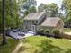 Exterior view of a home featuring a spacious deck with hot tub and an expansive backyard at 2329 Wedgewood Dr, Matthews, NC 28104