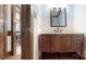 Bathroom showcasing custom wood vanity, drawers, and modern mirror with accent lighting at 2329 Wedgewood Dr, Matthews, NC 28104