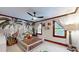Charming bedroom featuring playful jungle-themed wallpaper, a ceiling fan, and lots of natural light at 2329 Wedgewood Dr, Matthews, NC 28104