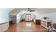 Spacious bonus room with hardwood floors, dormer window seat, and comfortable seating arrangements at 2329 Wedgewood Dr, Matthews, NC 28104
