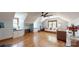 Expansive bonus room featuring hardwood floors, dormer window seat, and cozy seating arrangements at 2329 Wedgewood Dr, Matthews, NC 28104