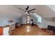 Large bonus room boasts hardwood floors, dormer window seat, and a peloton at 2329 Wedgewood Dr, Matthews, NC 28104